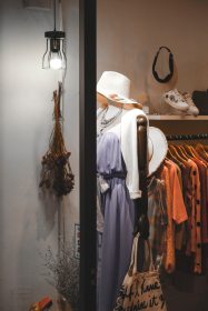 assorted-hanged-clothes-near-white-light-bulb-1233648